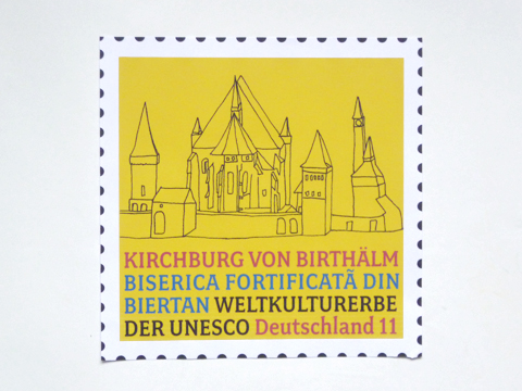 Stamp layout 'Kirchburg von Birthälm' (stamp series 'World Heritage Germany') for United Nations Postal Administration / © Gabriele Götz